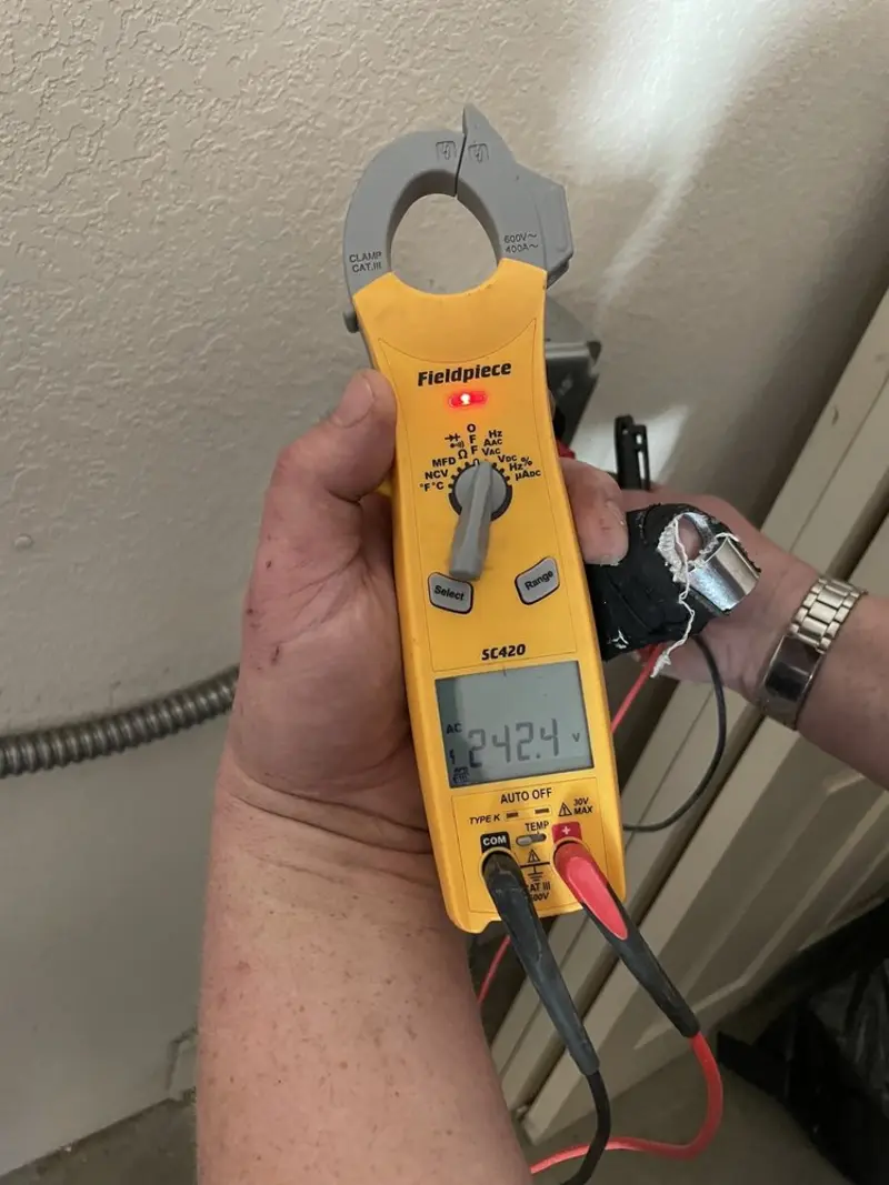 Voltage testing with clamp meter during Whole House Surge Protector in Hanceville